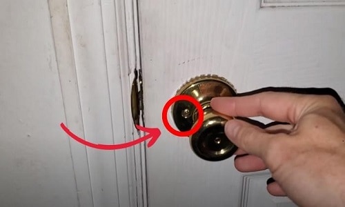 Locate-the-screws-on-both-the-exterior-and-interior-door-knobs